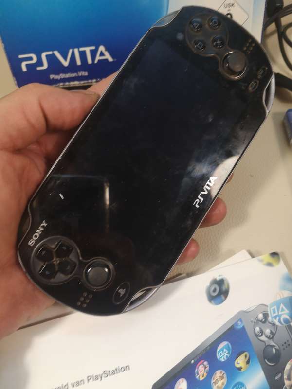 Complete PS Vita With Charge Cable, Booklets, Game and Original Box
