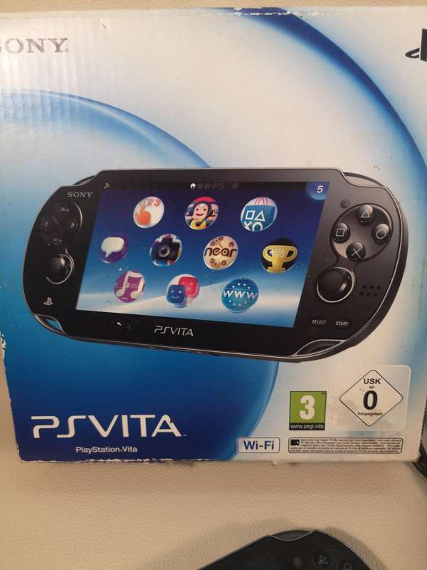 Complete PS Vita With Charge Cable, Booklets, Game and Original Box