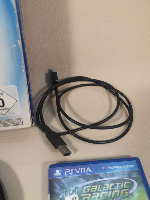 Complete PS Vita With Charge Cable, Booklets, Game and Original Box