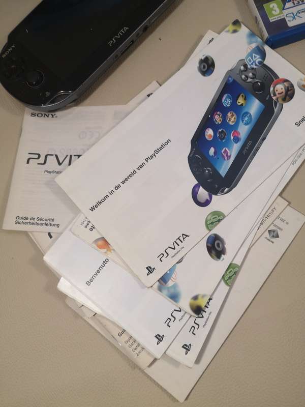 Complete PS Vita With Charge Cable, Booklets, Game and Original Box