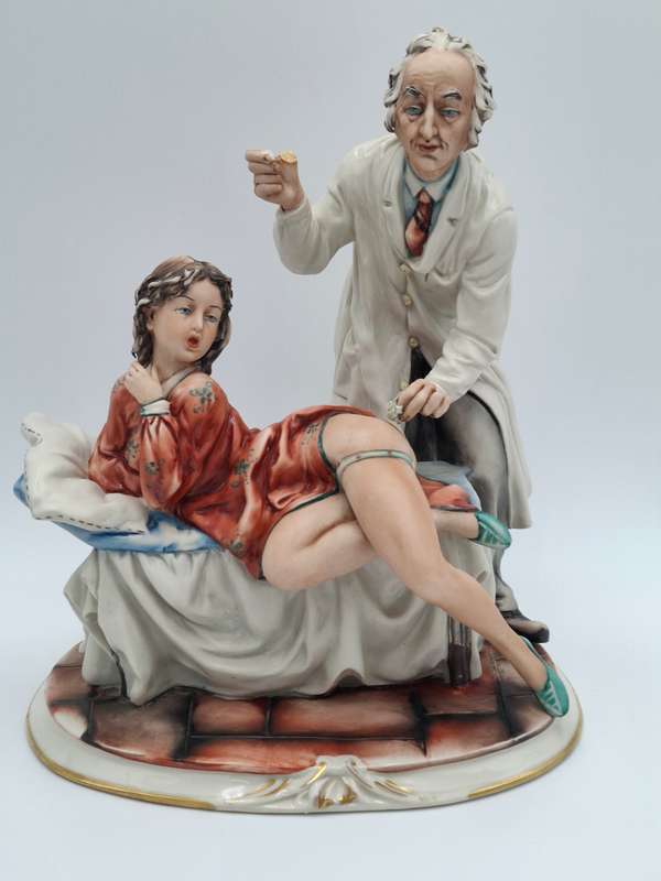 Captivating Italian Risque Capodimonte Sculpture - Doctor treating a Young Woman - Signed by Artist