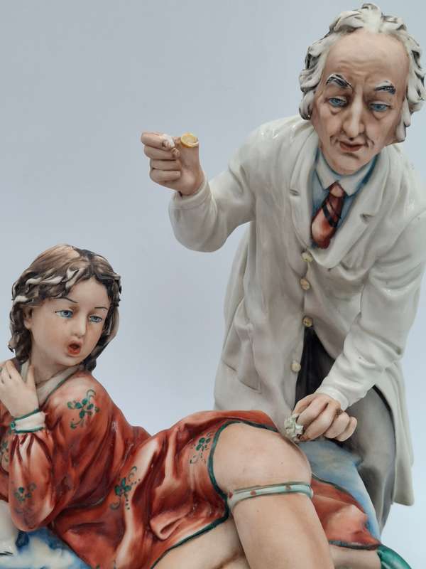 Captivating Italian Risque Capodimonte Sculpture - Doctor treating a Young Woman - Signed by Artist