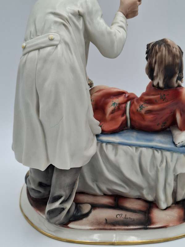 Captivating Italian Risque Capodimonte Sculpture - Doctor treating a Young Woman - Signed by Artist