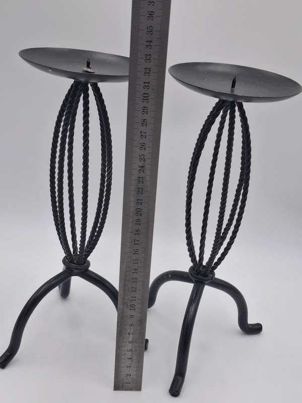 A Pair of Black Metal Candle Sticks for Pillar Candles - Rope Themed