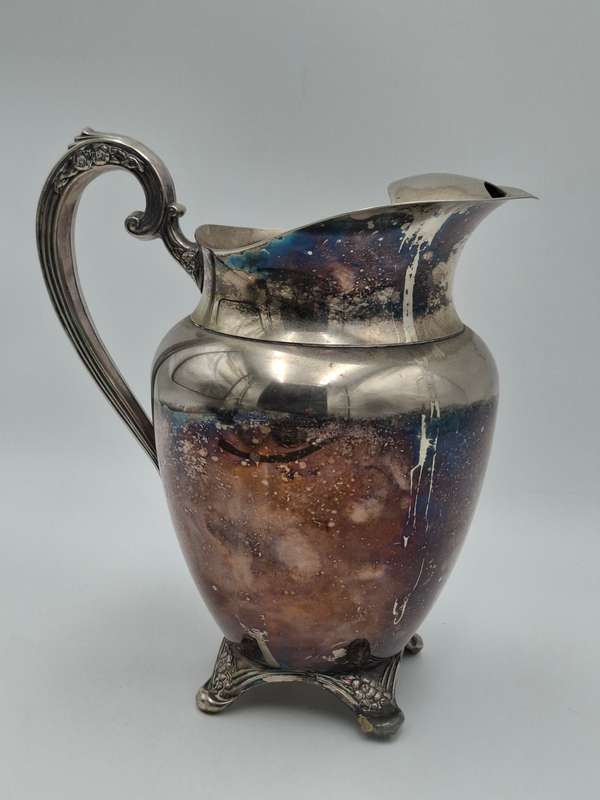 Vintage Silver Plated Pitcher with Embossed Ornate Design on the Handle and Base