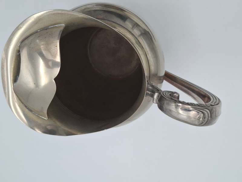 Vintage Silver Plated Pitcher with Embossed Ornate Design on the Handle and Base