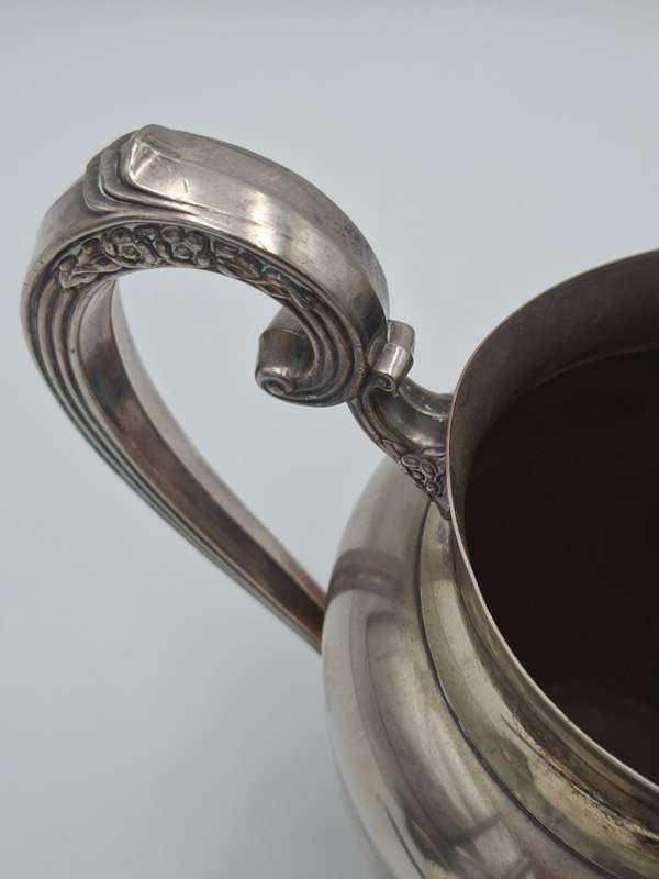 Vintage Silver Plated Pitcher with Embossed Ornate Design on the Handle and Base
