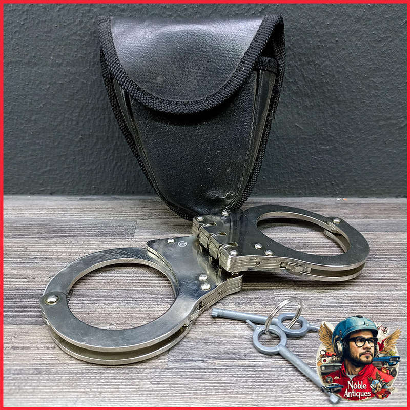 Handcuffs, chrome-plated, robust double lock and 3 hinges, with key and bag