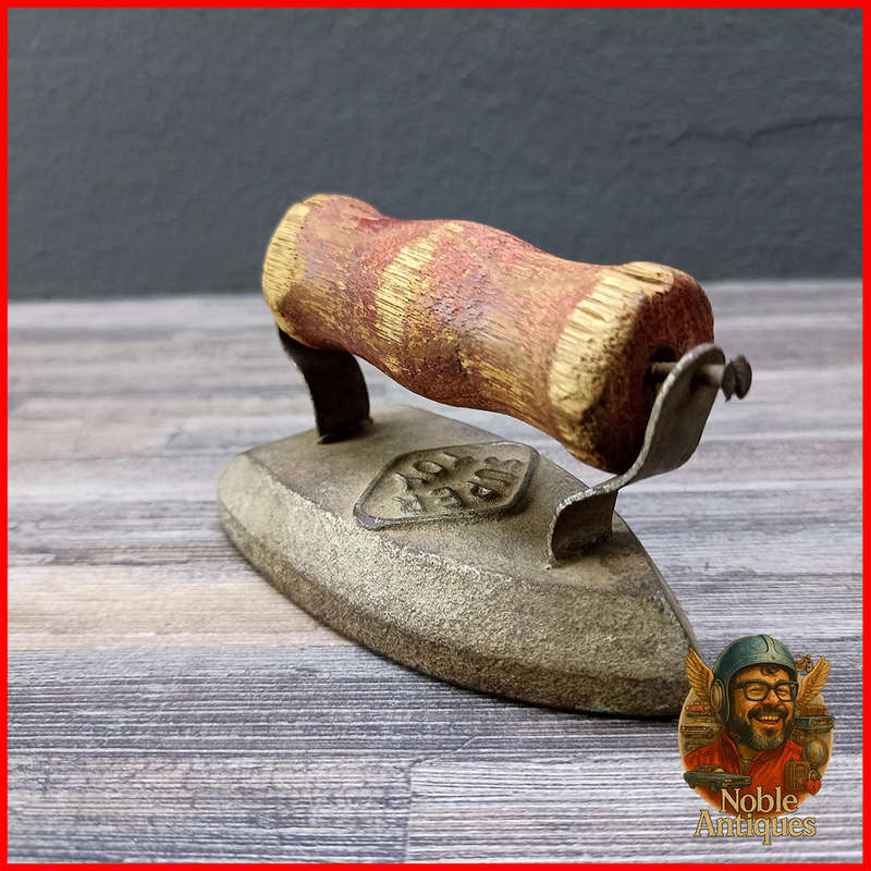 Vintage cast iron Super Toy Kids flat iron, with a wooden handle
