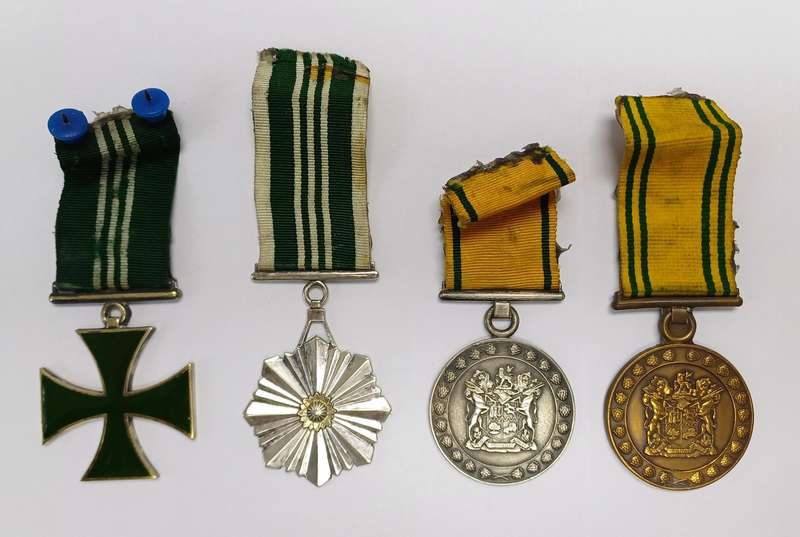 South African Prison Service Medal Group of 4, which includes Cross and Medal for Merit