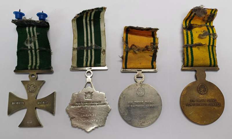 South African Prison Service Medal Group of 4, which includes Cross and Medal for Merit