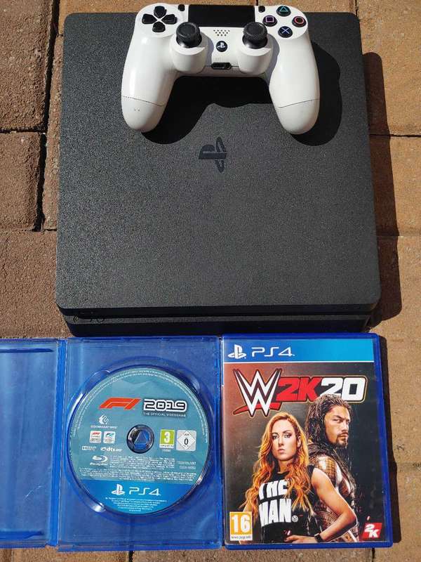 1tb PS4 console with 2x games, 1x controller