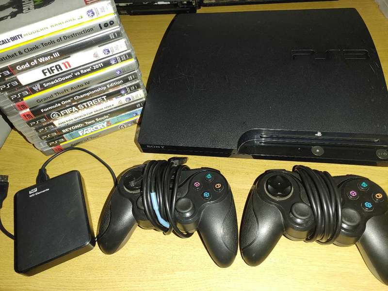 PS3 slim console with games and 2tb external hard drive