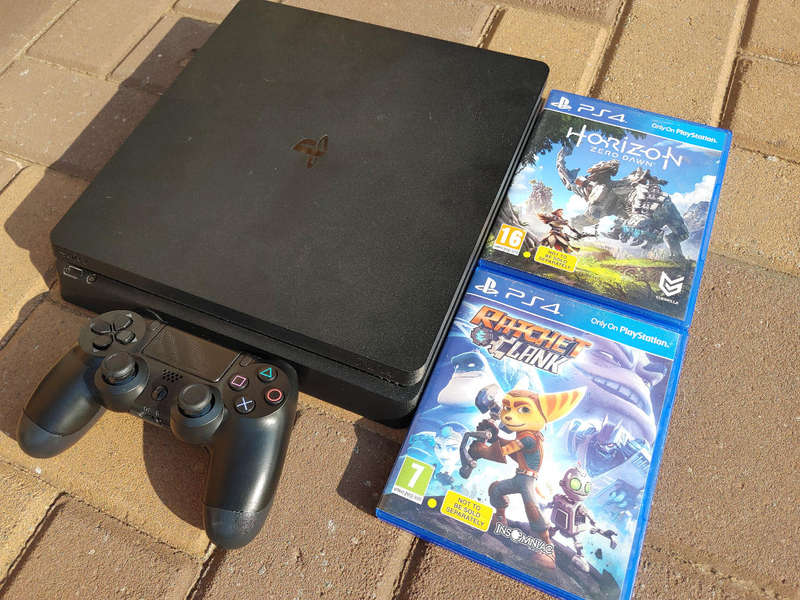 PS4 Slim Console with controller and games