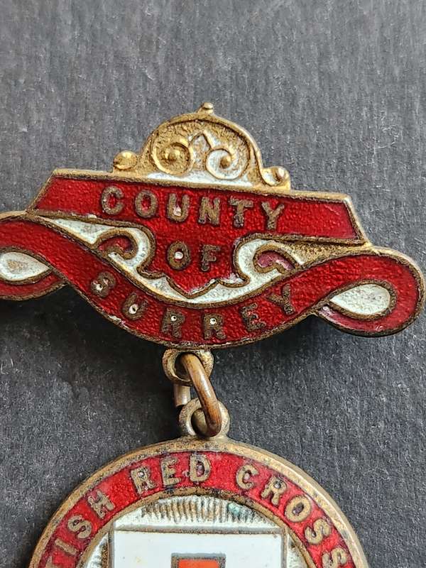 Enameled British Red Cross Society Badge awarded to Jessie Symonds no. 05305 Country of Surrey
