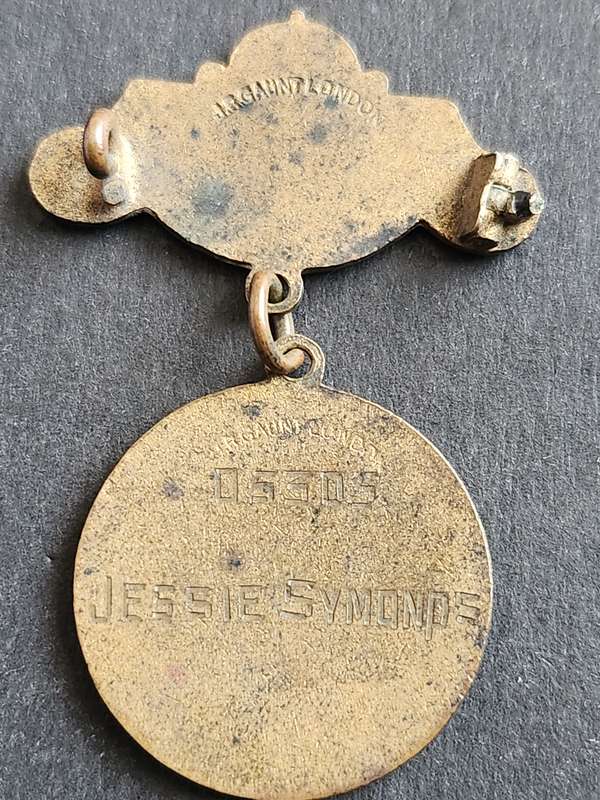 Enameled British Red Cross Society Badge awarded to Jessie Symonds no. 05305 Country of Surrey