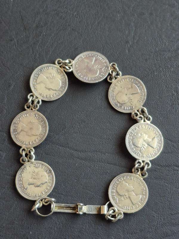 Rhodesia and Nysaland Tickey Bracelet  - 7 Threepences (various dates)