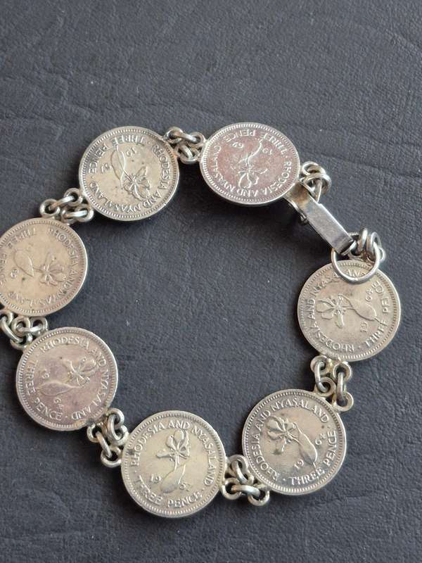 Rhodesia and Nysaland Tickey Bracelet  - 7 Threepences (various dates)