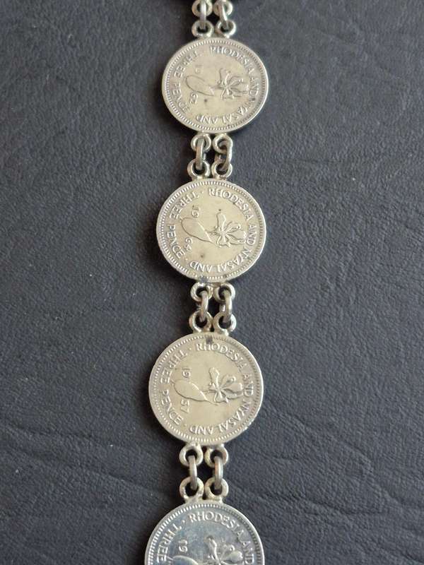 Rhodesia and Nysaland Tickey Bracelet  - 7 Threepences (various dates)
