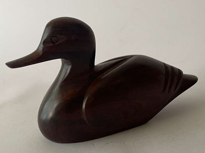 Hand carved Iorn wood duck dated and signed