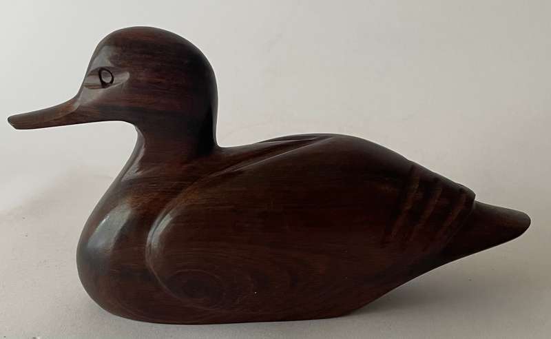 Hand carved Iorn wood duck dated and signed