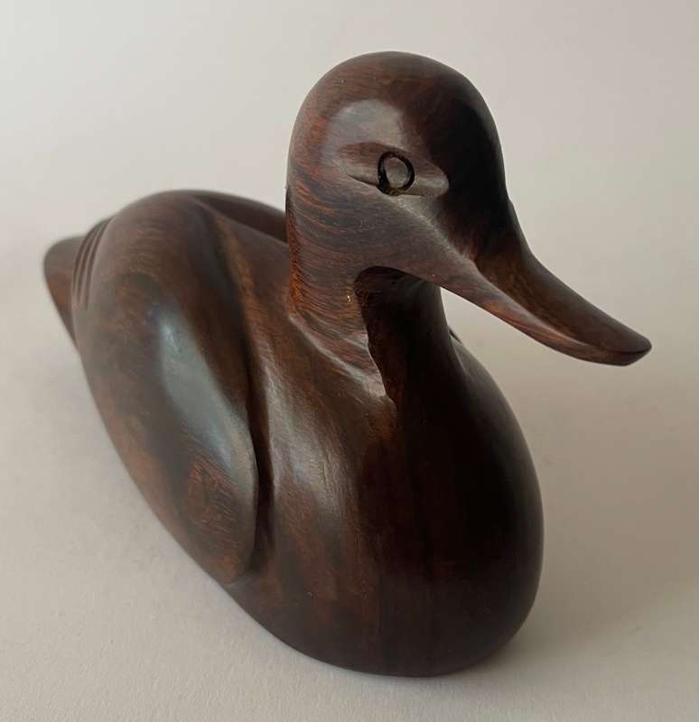 Hand carved Iorn wood duck dated and signed
