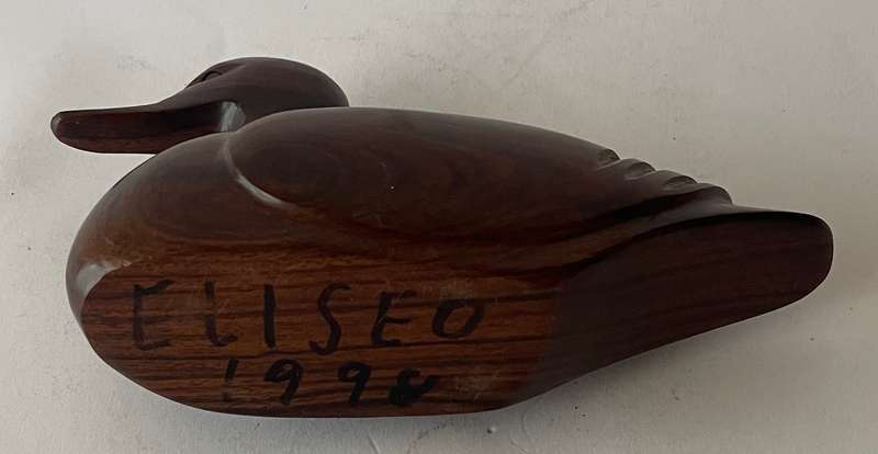 Hand carved Iorn wood duck dated and signed