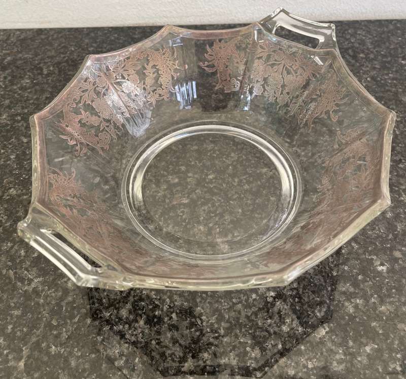A stunning double handle glass bowl with silver inlay