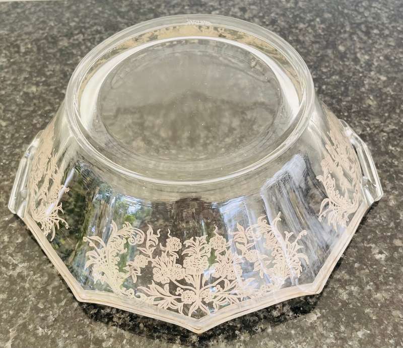 A stunning double handle glass bowl with silver inlay