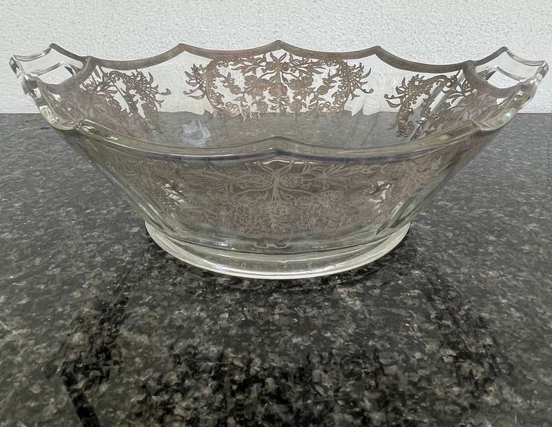 A stunning double handle glass bowl with silver inlay