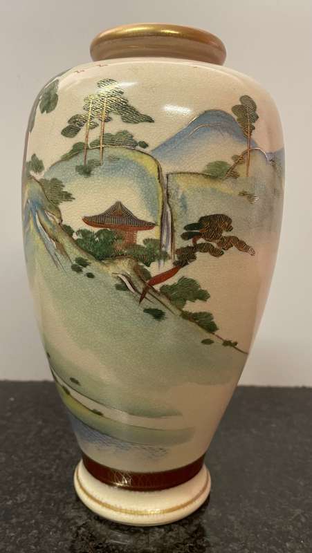 Beautiful earthenware Satsuma vase featuring a landscape scene with gold gilding