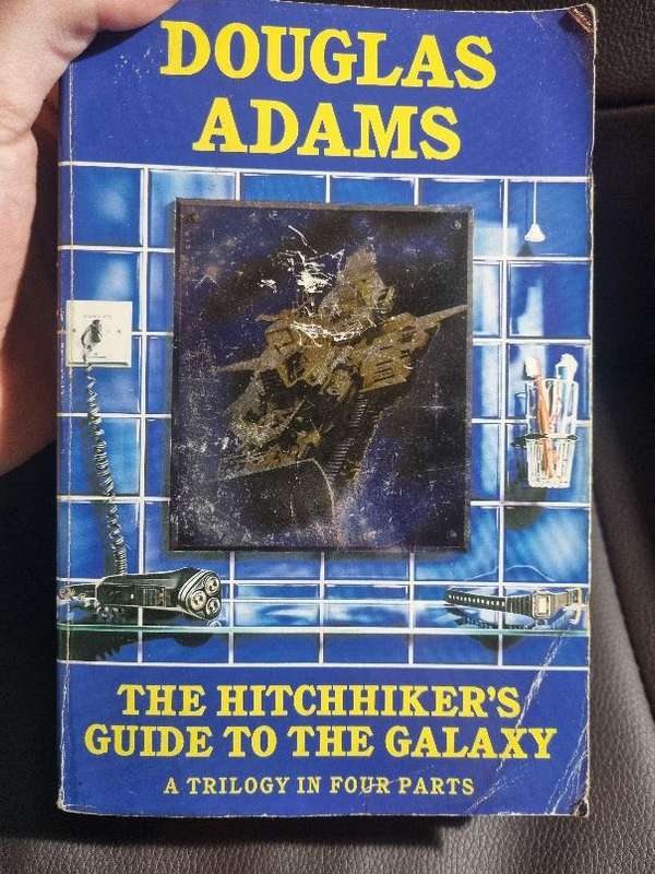 The Hitchhiker's Guide to the Galaxy - A Trilogy in Four Parts, by Douglas Adams