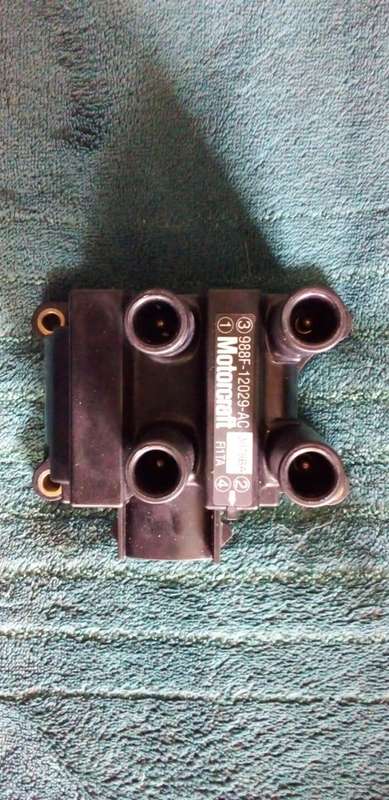 NEW ORIGINAL FORD ESCORT IGNITION COIL PACK.