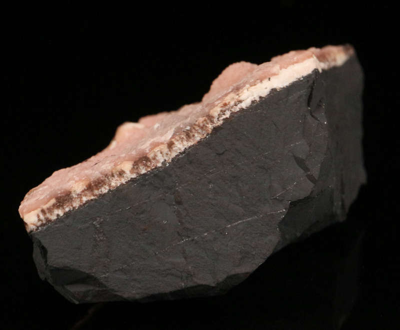 Rhodochrosite on Matrix, N'Chwaning II Mine, Kalahari Manganese Field, Northern Cape, South Africa.