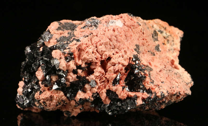 Hausmannite on Andradite,"N'Chwaning II Mine, Kalahari Manganese Field, Northern Cape, South Africa.