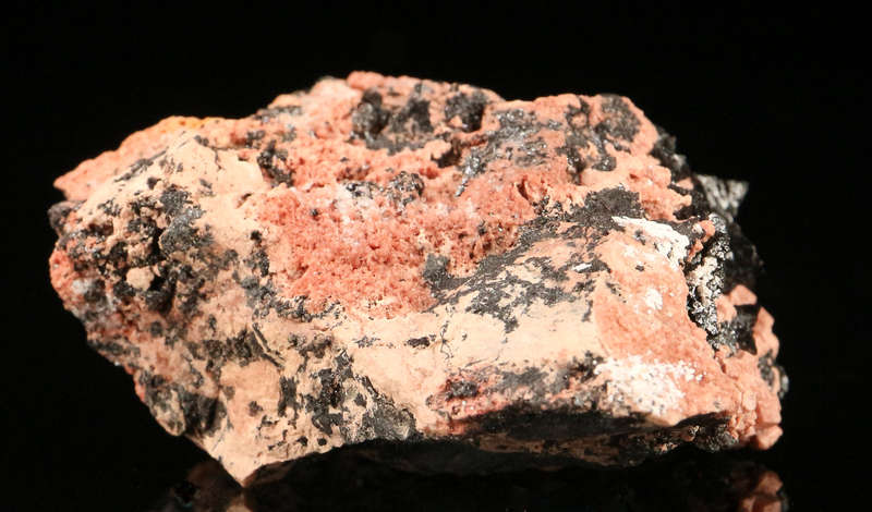 Hausmannite on Andradite,"N'Chwaning II Mine, Kalahari Manganese Field, Northern Cape, South Africa.