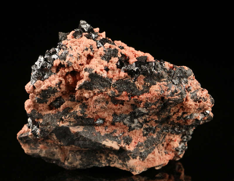 Hausmannite on Andradite,"N'Chwaning II Mine, Kalahari Manganese Field, Northern Cape, South Africa.