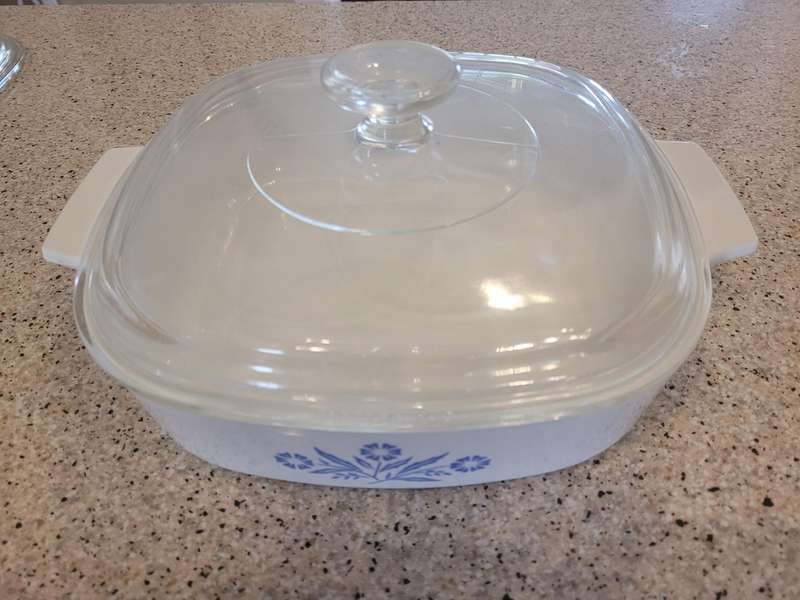 CORNINGWARE CORNFLOWER FROM THE 1960'S TO THE 1990'S-THREE OVENWARE DISHES, TWO WITH LIDS.