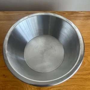 Used stainless steel mixing bowl.