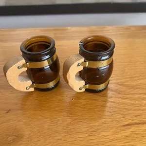 Vintage little glass tot measures with wooden handles