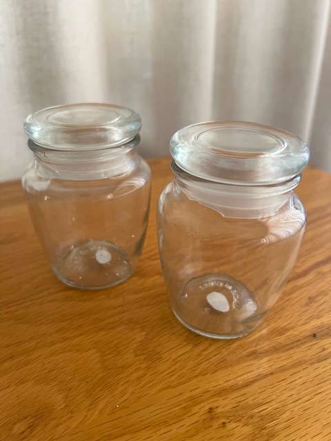 2 small glass jars for storage.  With lids.