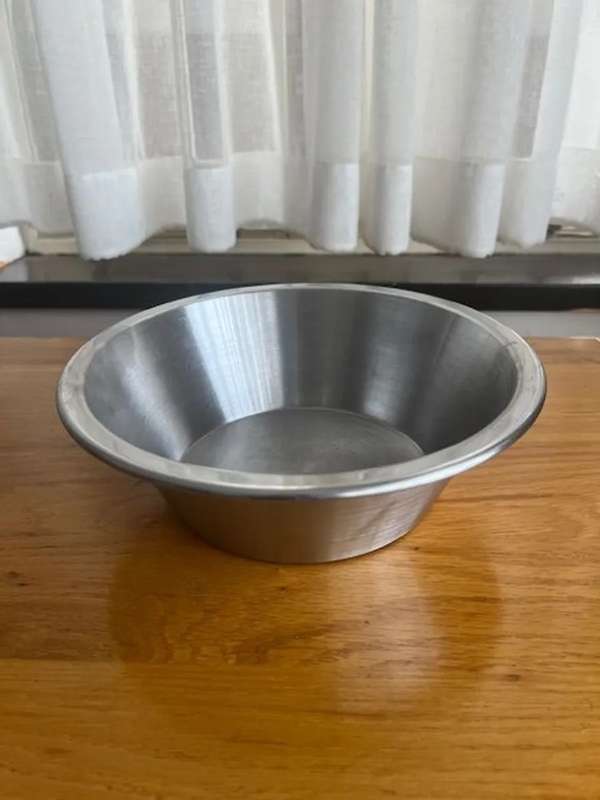 Used stainless steel mixing bowl.