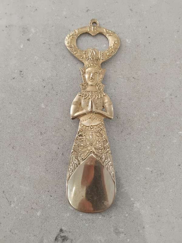 "Vintage" A stylized figure of a Thai deity - brass bottle opener.