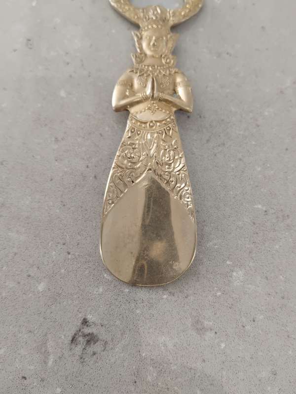 "Vintage" A stylized figure of a Thai deity - brass bottle opener.
