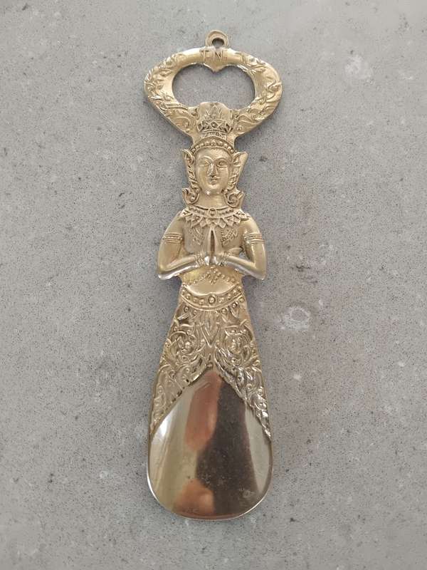 "Vintage" A stylized figure of a Thai deity - brass bottle opener.