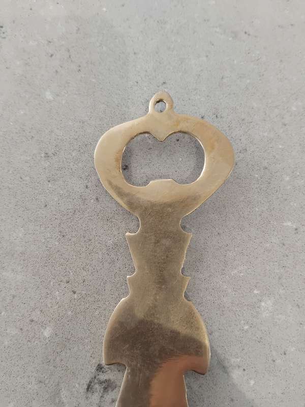 "Vintage" A stylized figure of a Thai deity - brass bottle opener.