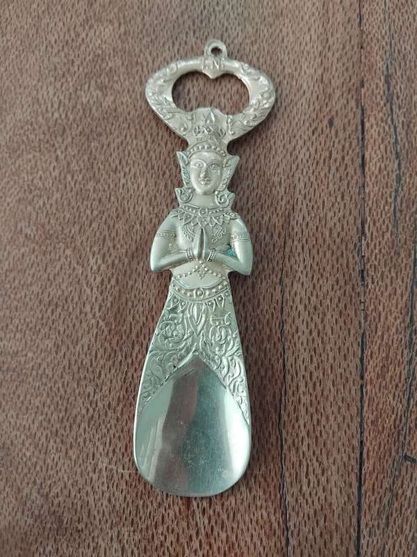 "Vintage" A stylized figure of a Thai deity - brass bottle opener.