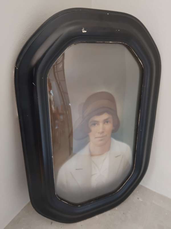 Antique octagon painted wooden frame with convex glass with portrait of a lady.