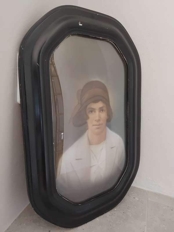 Antique octagon painted wooden frame with convex glass with portrait of a lady.