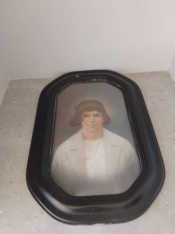 Antique octagon painted wooden frame with convex glass with portrait of a lady.